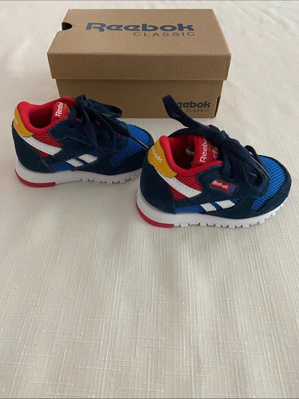 Reebok CL Leather Color Block Sneakers for babies.